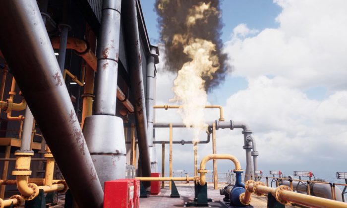 منشأة صناعية كبيرة تنبعث منها سحابة كبيرة من الدخان الأسود وألسنة اللهب من هيكل أنبوبي، محاط بأنابيب صفراء وفضية، تحت سماء ملبدة بالغيوم جزئيًا.