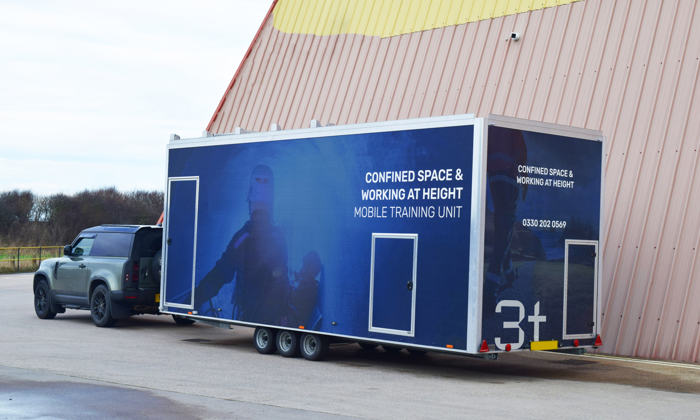 3t's mobile training unit attached to a car.